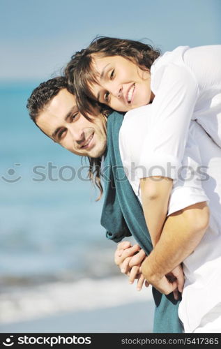 happy young couple in white clothing have romantic recreation and fun at beautiful beach on vacations