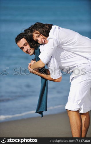 happy young couple in white clothing have romantic recreation and fun at beautiful beach on vacations