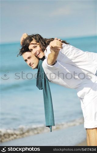 happy young couple in white clothing have romantic recreation and fun at beautiful beach on vacations