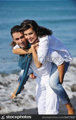 happy young couple in white clothing have romantic recreation and fun at beautiful beach on vacations