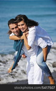 happy young couple in white clothing have romantic recreation and fun at beautiful beach on vacations