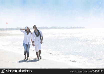 happy young couple in white clothing have romantic recreation and fun at beautiful beach on vacations