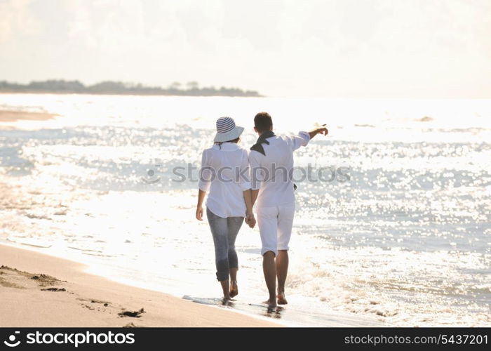 happy young couple in white clothing have romantic recreation and fun at beautiful beach on vacations