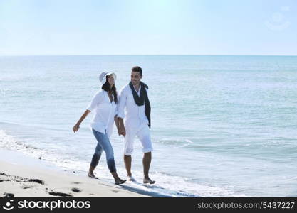 happy young couple in white clothing have romantic recreation and fun at beautiful beach on vacations