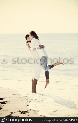 happy young couple in white clothing have romantic recreation and fun at beautiful beach on vacations