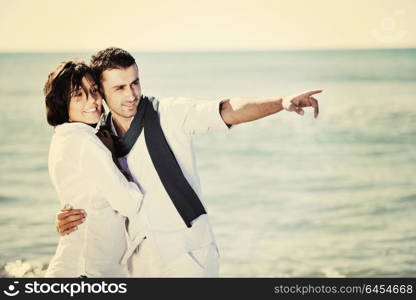 happy young couple in white clothing have romantic recreation and fun at beautiful beach on vacations