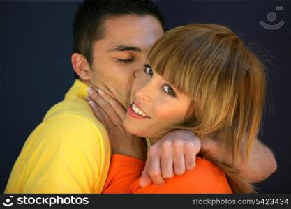 Happy young couple kissing