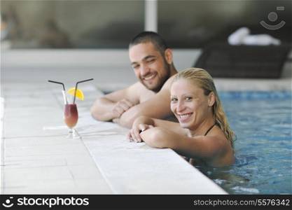 happy young couple on wellness and spa beauty treatment in bath and bed