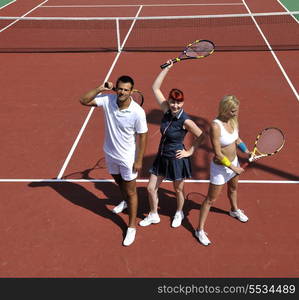 happy young couple play tennis game outdoor man and woman