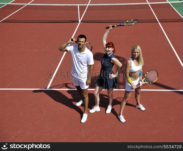 happy young couple play tennis game outdoor man and woman