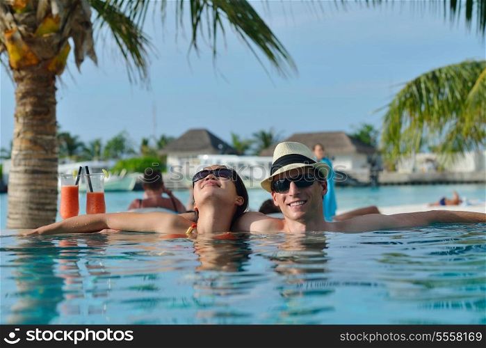 happy young couple relax and take fresh drink at summer vacation