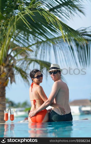 happy young couple relax and take fresh drink at summer vacation