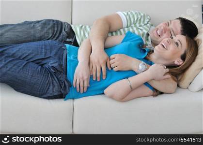 happy young couple relax at home in modern and bright living room