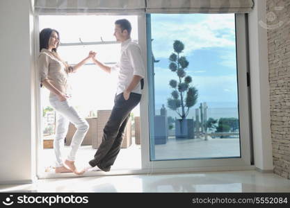 happy young couple relax at modern home living room indoor