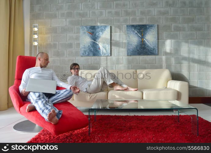 happy young couple relax at modern home living room indoor