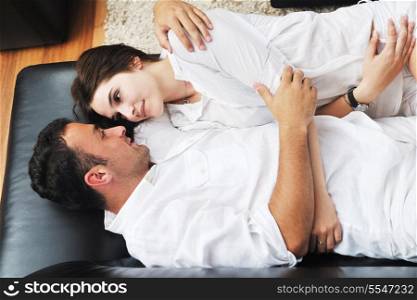 happy young couple relax at modern home livingroom indoor