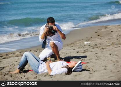 happy young couple relaxing in nature white making photos and taking images and posing for camera