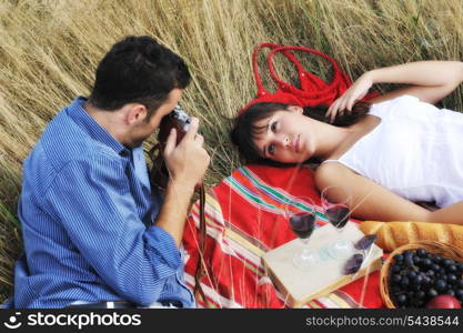 happy young couple relaxing in nature white making photos and taking images and posing for camera