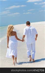 Happy Young Couple Running or Walking Holding Hands on Tropical Beach