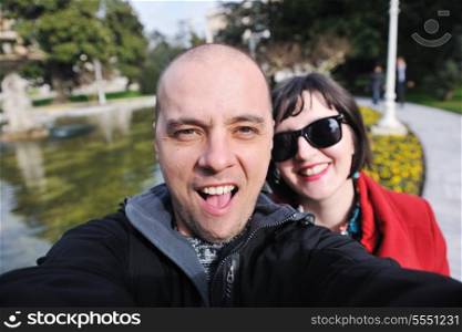 happy young couple self portrait outdoor at sunny day