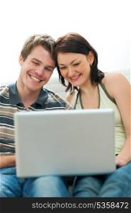 Happy young couple surfing internet