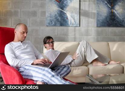 happy young Couple Using Laptop computer At Home