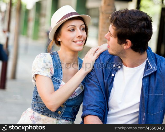 Happy young couple walking in city. Happy smiling young couple walking in city