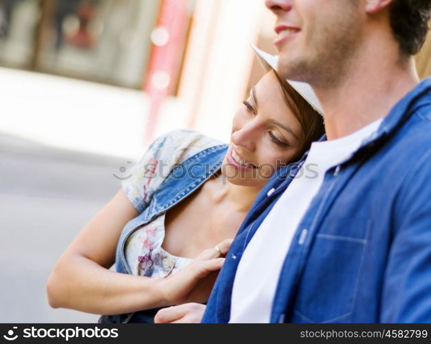 Happy young couple walking in city. Happy smiling young couple walking in city