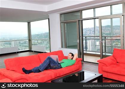 happy young cuple have fun and relax in their new big bright home apartment
