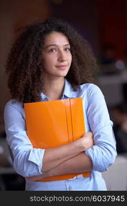 happy young curly business woman in the modern office