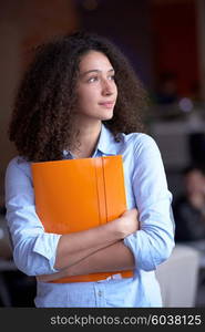 happy young curly business woman in the modern office