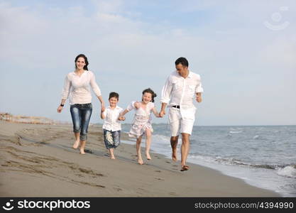 happy young family have fun and live healthy lifestyle on beach