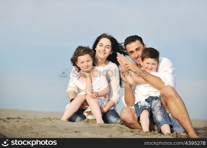 happy young family have fun and live healthy lifestyle on beach