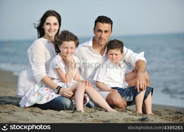 happy young family have fun and live healthy lifestyle on beach