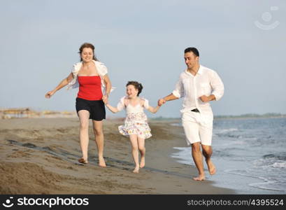 happy young family have fun and live healthy lifestyle on beach