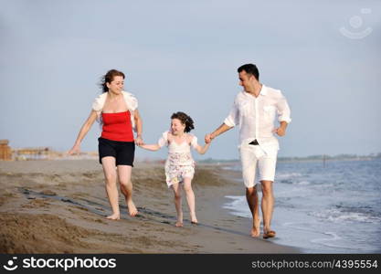 happy young family have fun and live healthy lifestyle on beach