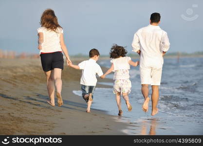 happy young family have fun and live healthy lifestyle on beach