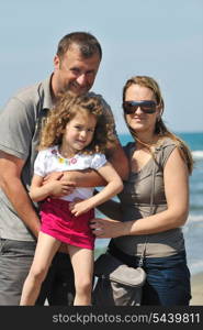 happy young family have fun and live healthy lifestyle on beach