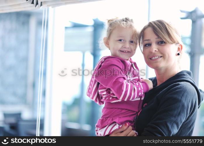 happy young family have fun and relaxing at new home with bright furniture