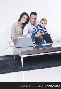 happy young family have fun and relaxing at new home with bright furniture