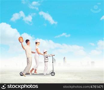 Happy young family. Image of happy young family riding on scooter