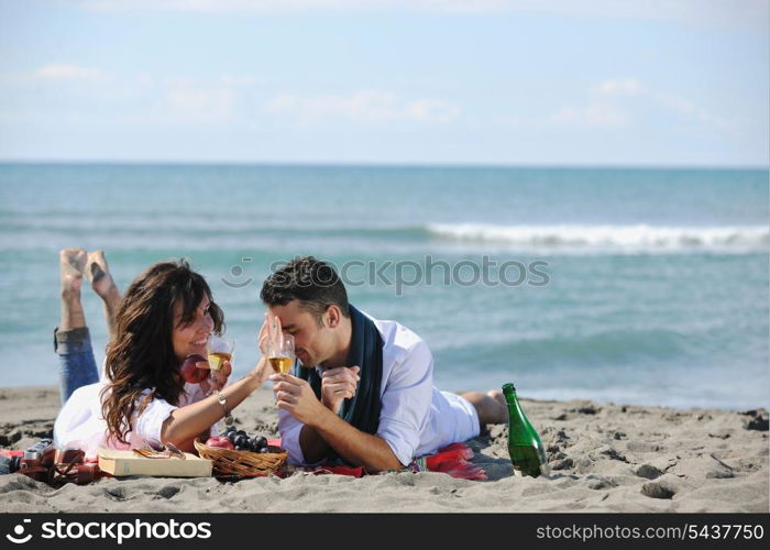 happy young family in white clothing have fun and play with beautiful dog at vacations on beautiful beach