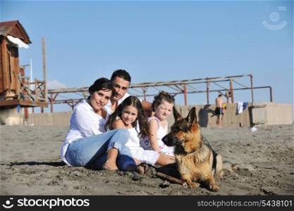 happy young family in white clothing have fun and play with beautiful dog at vacations on beautiful beach
