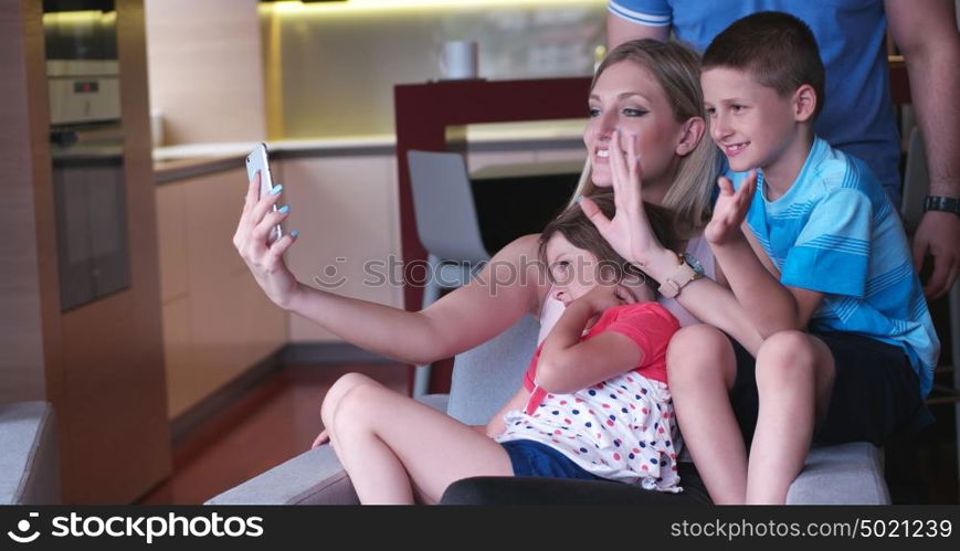 Happy Young Family Playing Together at home. cuple spending time with kids