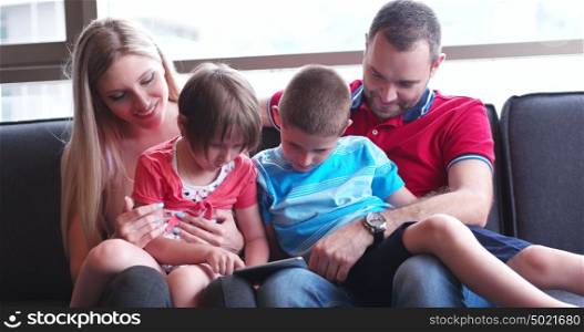 Happy Young Family Playing Together at home. cuple spending time with kids