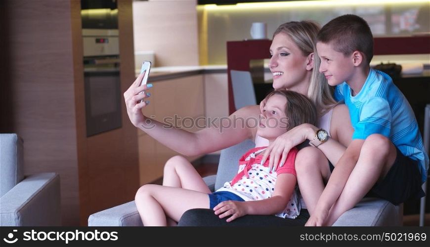 Happy Young Family Playing Together at home. cuple spending time with kids