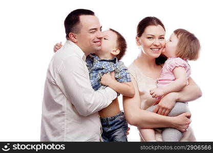 Happy young family with pretty child posing on white background