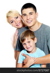 Happy young family with son of 6 years posing over white background
