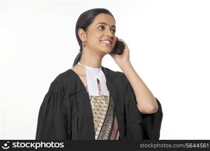Happy young female lawyer on call isolated over white background