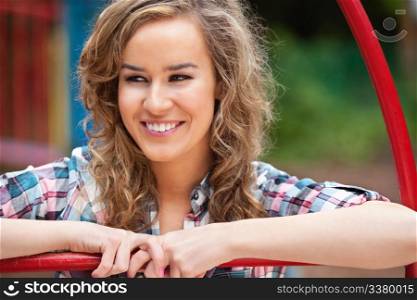Happy young female looking away and smiling outdoors